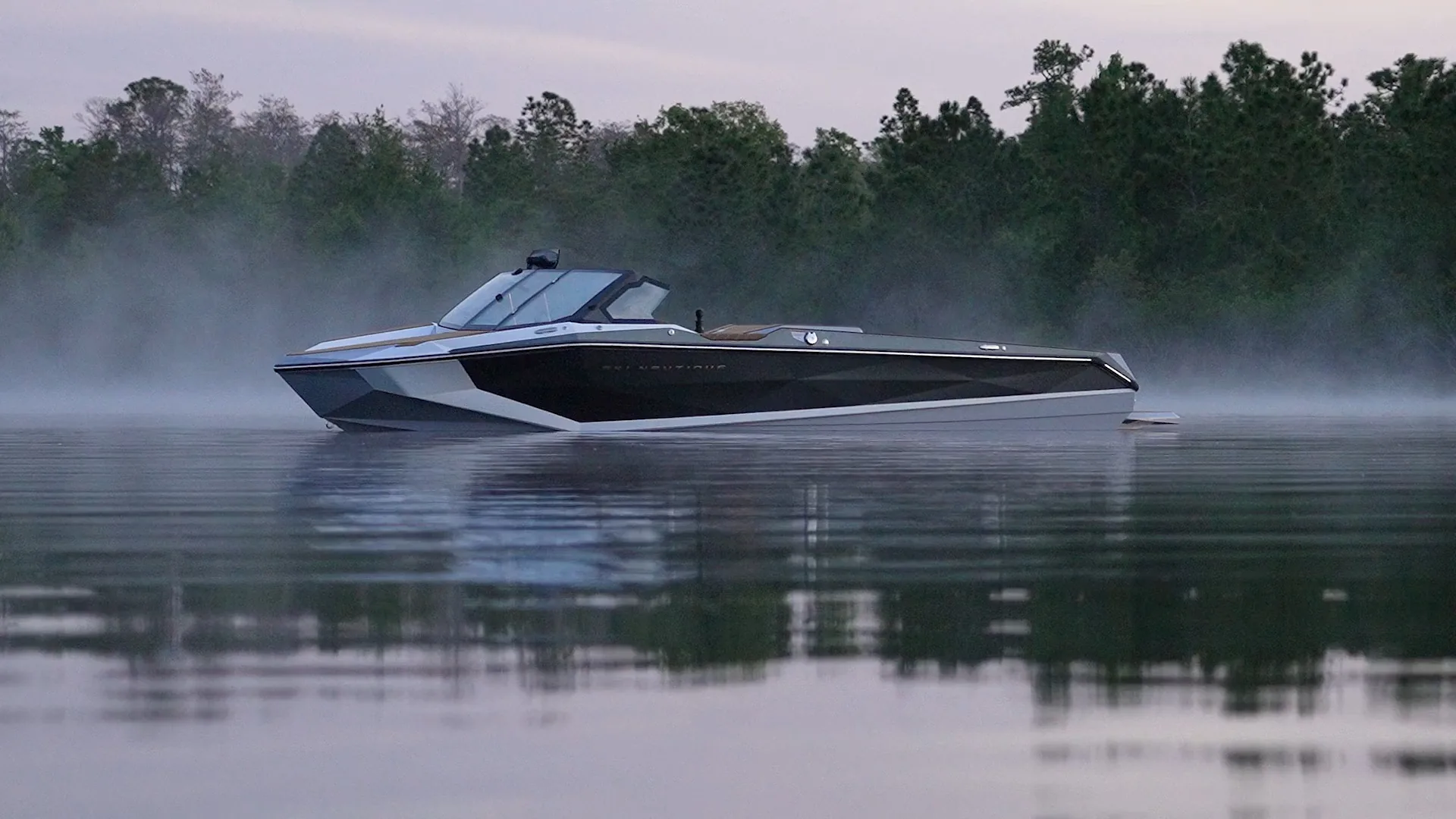 Wakeboarder behind a Nautique